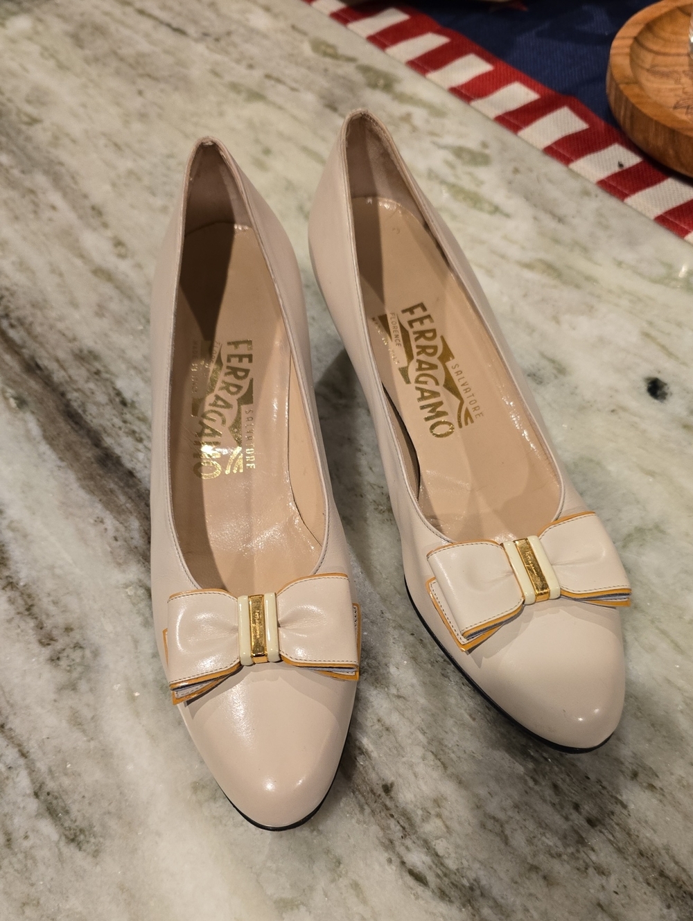 Salvatore Ferragamo Cream Bow Pumps with Gold Accent